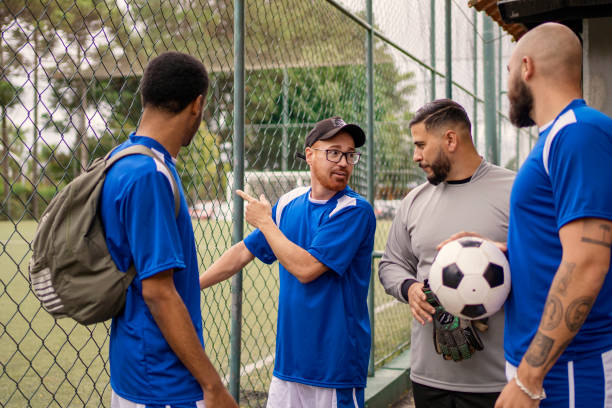 istock Men's soccer team talking before playing soccer 1396970193