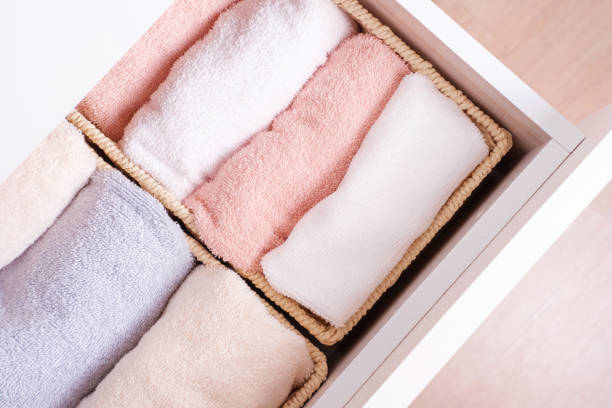 istock Folded towels in dresser close-up, space organization concept. 1396971329