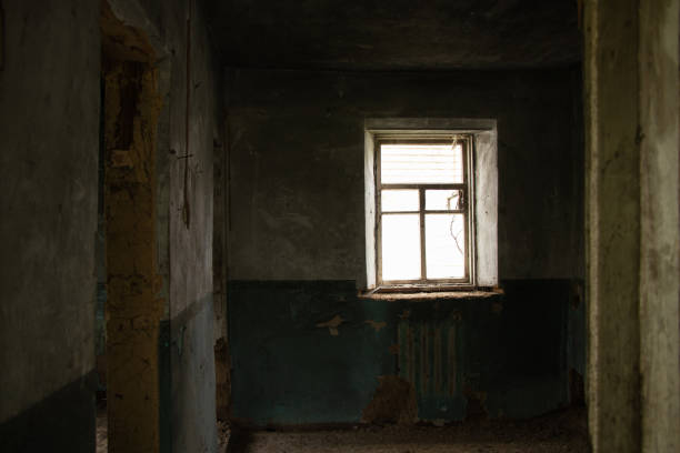 istock old abandoned one-story building dark without windows and doors, destroyed building 1396972089