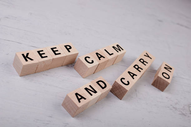 istock wooden blocks building the word KEEP CALM AND CARRY ON 1396973308