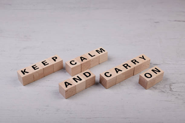 istock wooden blocks building the word KEEP CALM AND CARRY ON 1396973339