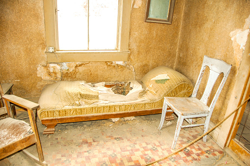 Picture of some of the abandoned room left behind in Bodie, California. Bodie is a ghost town that has now become a historical state park.This bedroom was left as it was on the day of abandonment.