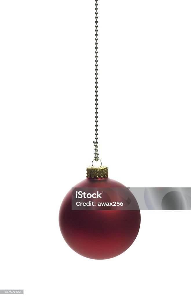 Dark red christmas ball Vertical shot of a dark red christmass ball over white background Celebration Stock Photo