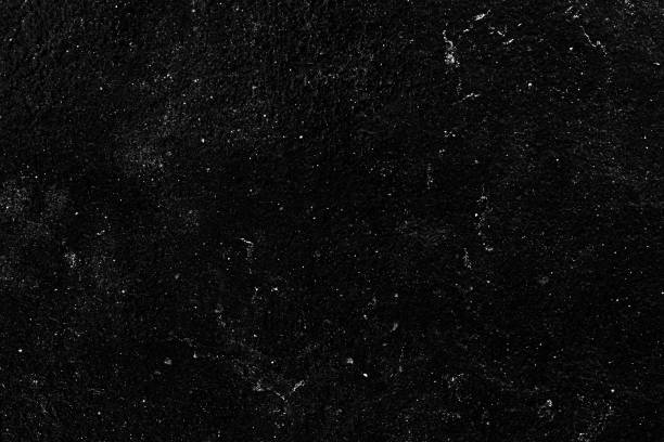 Stone black texture background. Dark cement wall stock photo