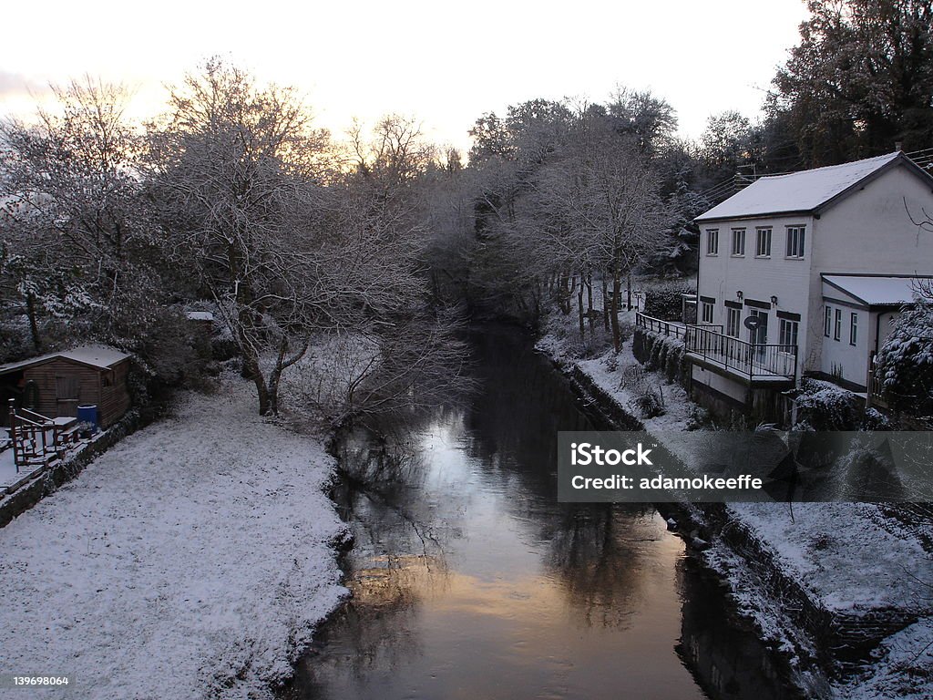 Wintry scene of a canal in Wales Wintry scene of a canal in Wales with sunrise refelcting of the canal Canal Stock Photo