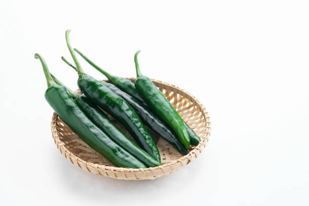 istock Green chili on white background. 1396981879