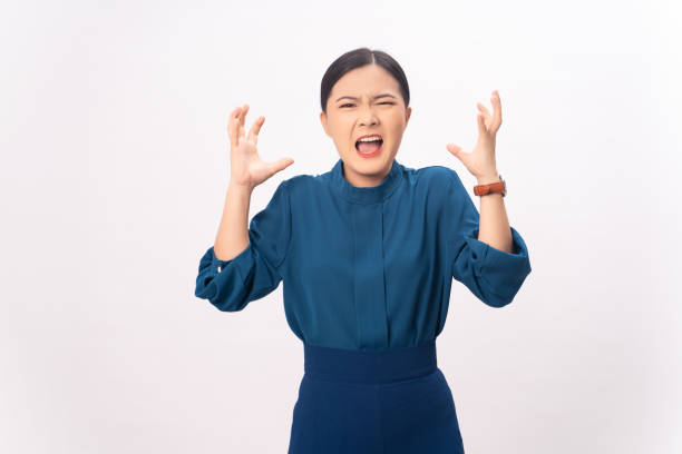 istock Asian woman angry and shouting isolated on background. 1396981987