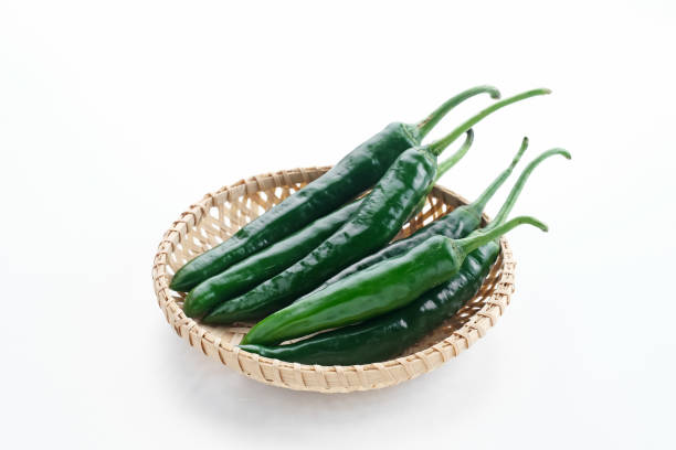istock Green chili on white background. 1396982041