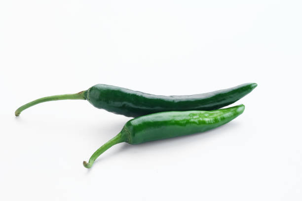 istock Green chili on white background. 1396982044