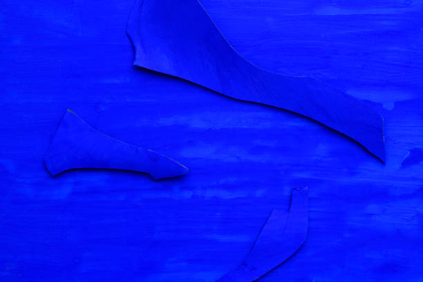 Close-up of dark blue canvas and small pieces of blue with copy space.