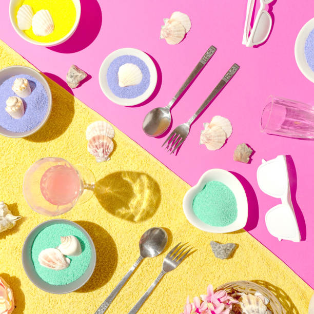 Creative arrangement made of various beach picnic elements. Summer scene with sunny day shadows. Outdoor lifestyle concept. Flat lay aesthetic.