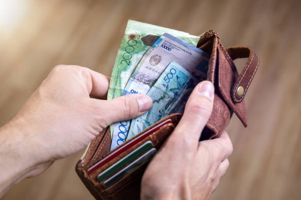 istock Kazakh Tenge banknotes in a wallet 1396988393