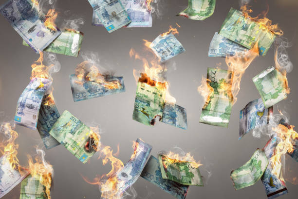 istock Burning Kazakh Tenge banknotes falling down 1396988403