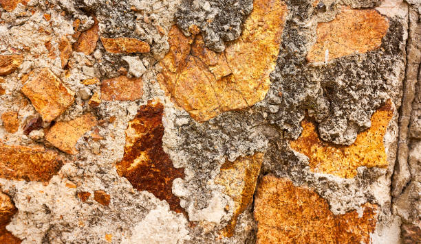 istock Stone wall close-up. The background of an old wall. 1396988932
