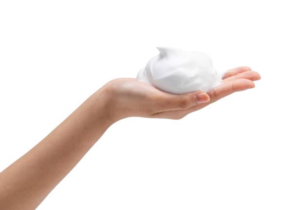 istock Female hand with soap bubbles on white background. 1396989005