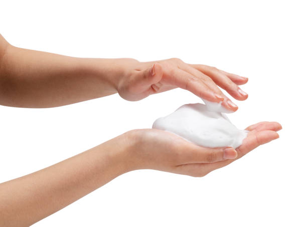 istock Female hand with soap bubbles on white background. 1396989008