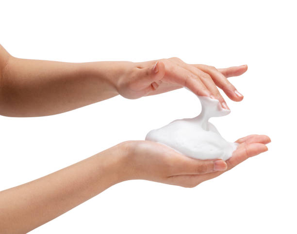 istock Female hand with soap bubbles on white background. 1396989009