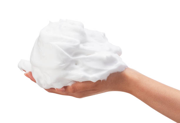 istock Female hand with soap bubbles on white background. 1396989044