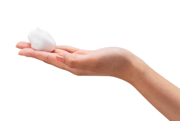 istock Female hand with soap bubbles on white background. 1396989051