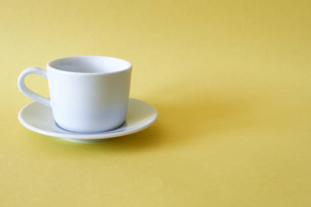 istock White tea pair on a yellow background. Space for copying. 1396989650