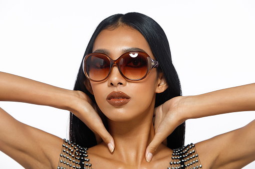 Collage Half body of 20s Asian woman tanned skin black long straight hair with Fashion Luxury glasses sunglasses. Honey skin female express feeling smile happy over white background isolated