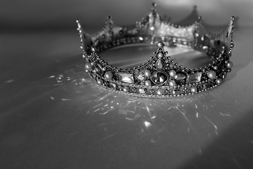 Old style, vintage crown. Symbol of authority, power and wealth. Black and white photo, monochrome.