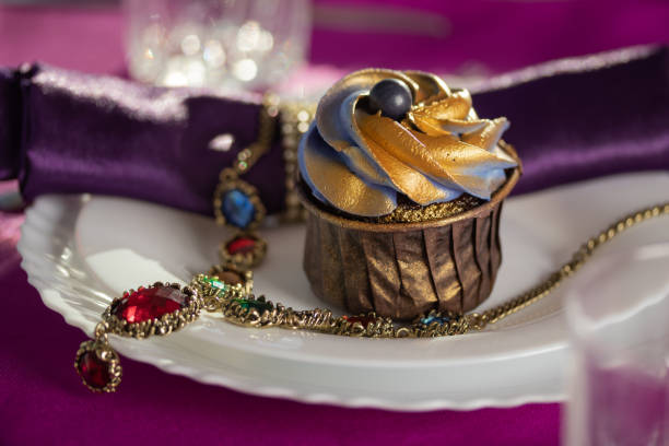 Pink and purple decoration and cupcakes on the table