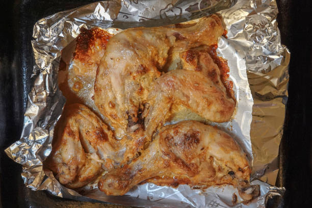 istock Golden chicken legs in batter fried in a pan 1396993792