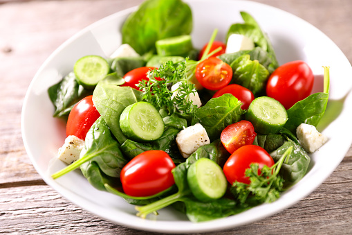 vegetable salad with cucumber, tomato and spinach