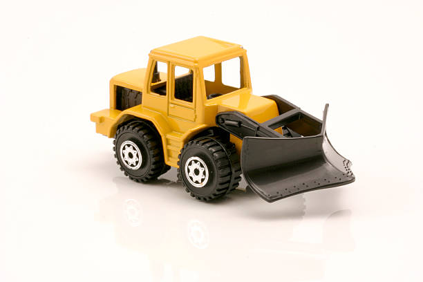 istock Kid's toy yellow snow plough on white background 139699545