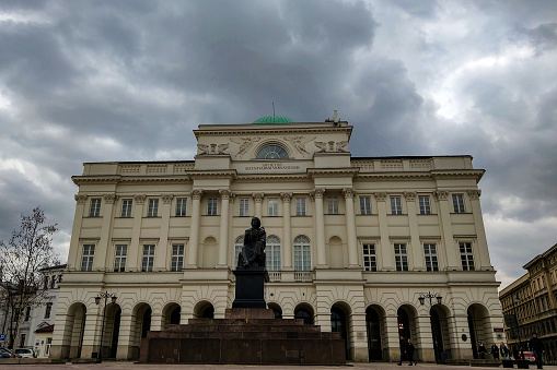 Warsaw, Poland, March 8, 2019: Nicolaus Copernicus Monument sculpted house of Polish Academy of Sciences