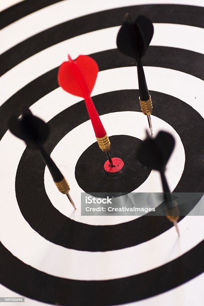 Bull's Eye The red dart smack in the center of the board symbolizing perfection Accessibility Stock Photo Bull's Eye The red dart smack in the center of the board symbolizing perfection Accessibility Stock Photo