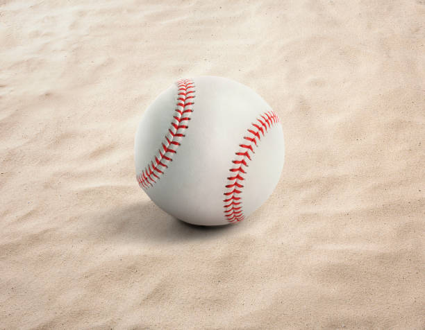 istock baseball ball on the sand, beach, sea 1397006534