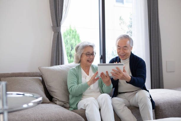 istock Asian senior couple using a digital tablet at home. 1397006562