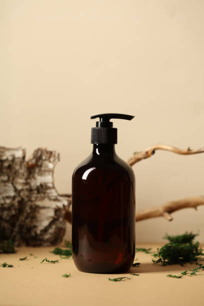 istock Soap or shampoo pump bottle with bark, tree branch, green moss. SPA natural cosmetic concept. 1397009909