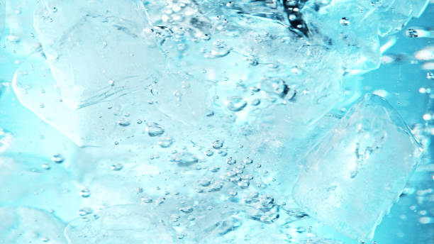 istock Close up of ice cubes underwater, blue background. 1397010108