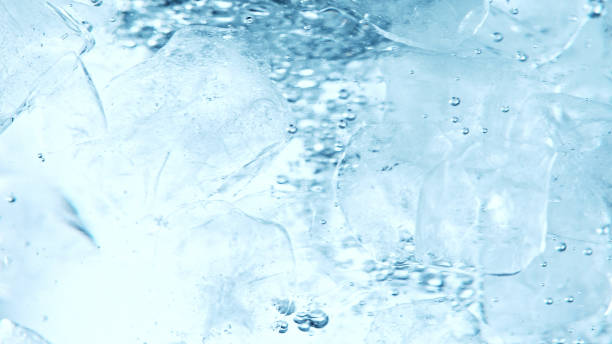 istock Close up of ice cubes underwater, blue background. 1397010127