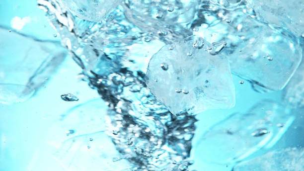 istock Close up of ice cubes underwater, blue background. 1397010247