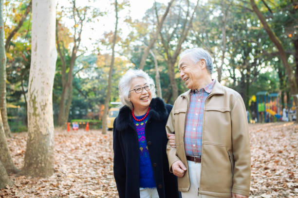 istock A senior couple happily strolling in the park. 1397011521