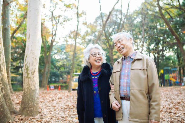 istock A senior couple happily strolling in the park. 1397011522