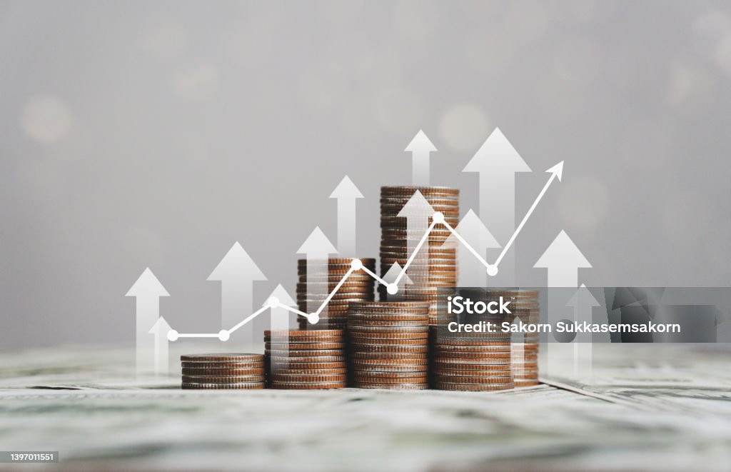stack of silver coins with trading chart in financial concepts and financial investment business stock growth Investment Stock Photo