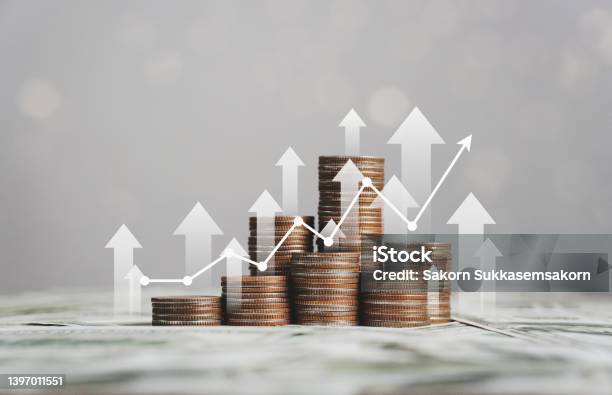 Stack Of Silver Coins With Trading Chart In Financial Concepts And Financial Investment Business Stock Growth Stock Photo - Download Image Now