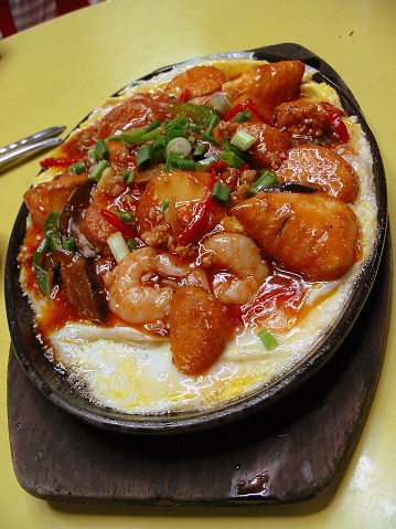 Egg tofu with chili, meat, prawns, mushrooms and egg in a hot-plate