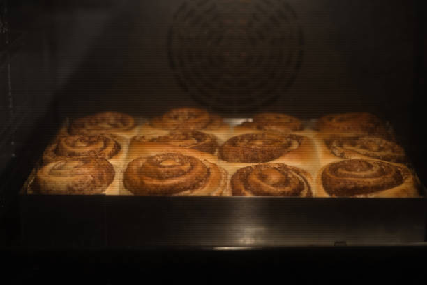 fresh and ready cinnabon buns in the oven. Close up