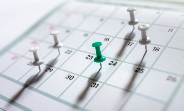 istock Calendar appointment thumbtacks in various dates on calendar diary 1397013113