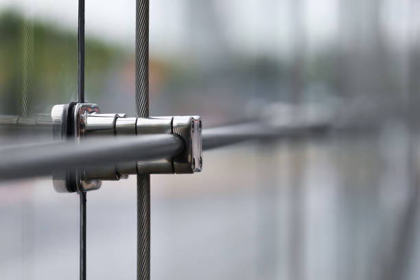 Closeup Stainless fasteners elements of glass curtain walls system.