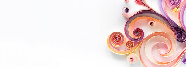 Quilling paper art long banner on white background with copy space. Filigree paper hobby header. Elegant curls and rolls from colored paper for abstract panels. Quilling paper art long banner on white background with copy space. Filigree paper hobby header. Elegant curls and rolls from colored paper for abstract panels. paper quilling stock pictures, royalty-free photos & images