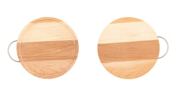 istock Two round wooden beech cutting board with handle isolated on white background, top view 1397013986