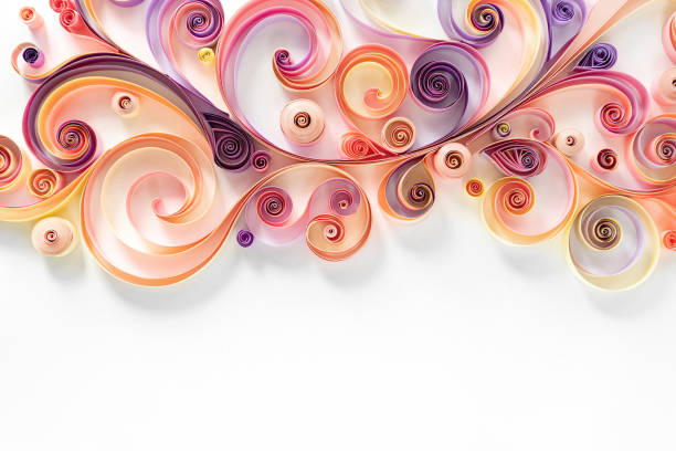 Quilling paper abstract background with copy space. Filigree paper floral banner. Hobby concept. Strips of colored paper are twisted into rolls and curls on a white background. Quilling paper abstract background with copy space. Filigree paper floral banner. Hobby concept. Strips of colored paper are twisted into rolls and curls on a white background. paper quilling stock pictures, royalty-free photos & images