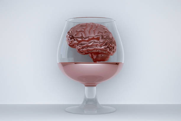 glass of wine with human brain inside stock photo